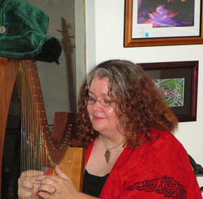 Gwen, playing the harp at the Phoenix & Dragon (photo)